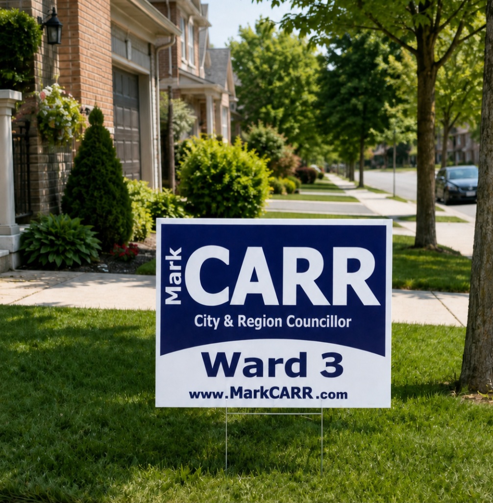 A Mark Carr Ward 3 campaign lawn sign on a Burlington front lawn